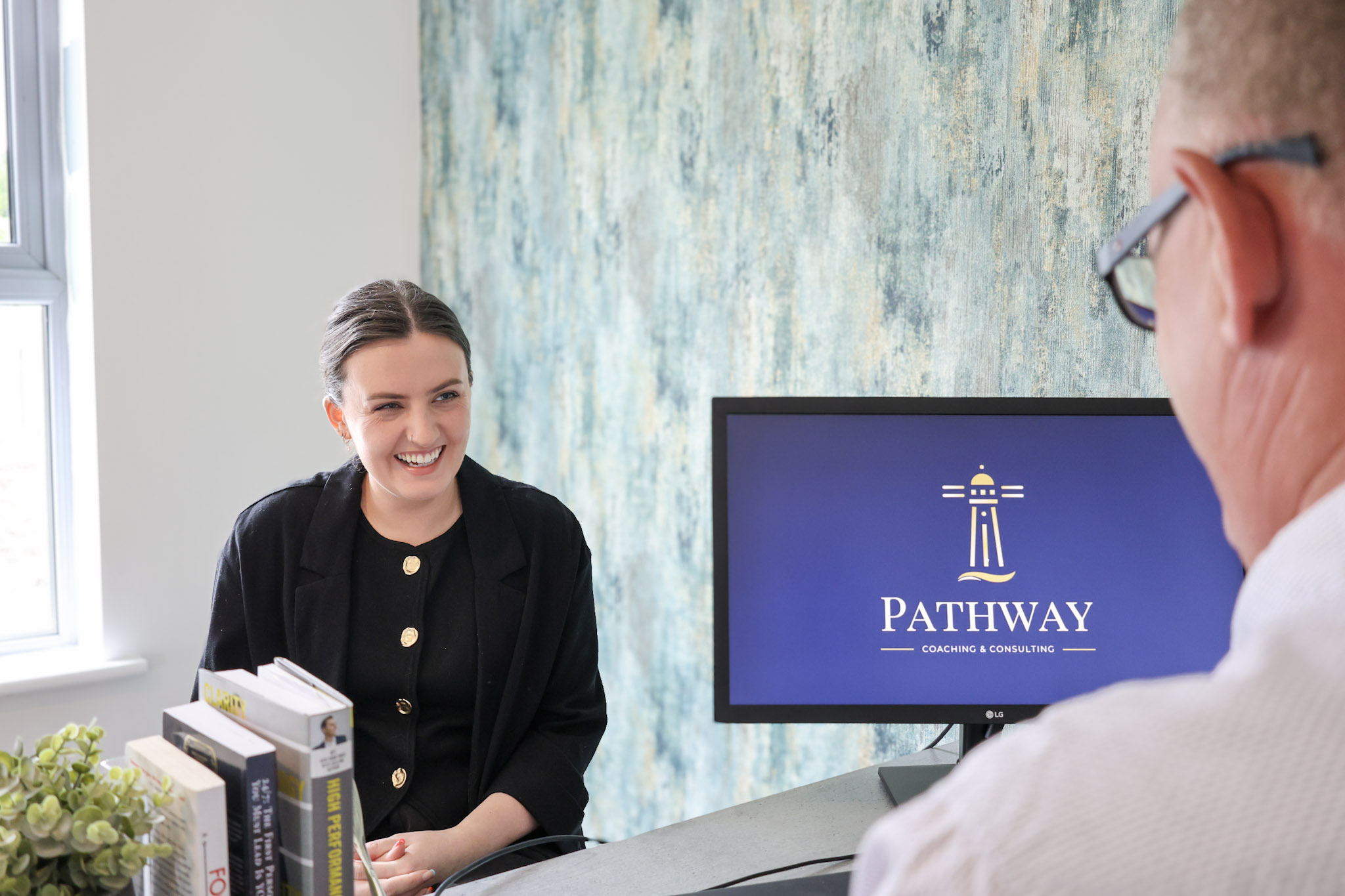 a photo of Daniels client smiling in a session